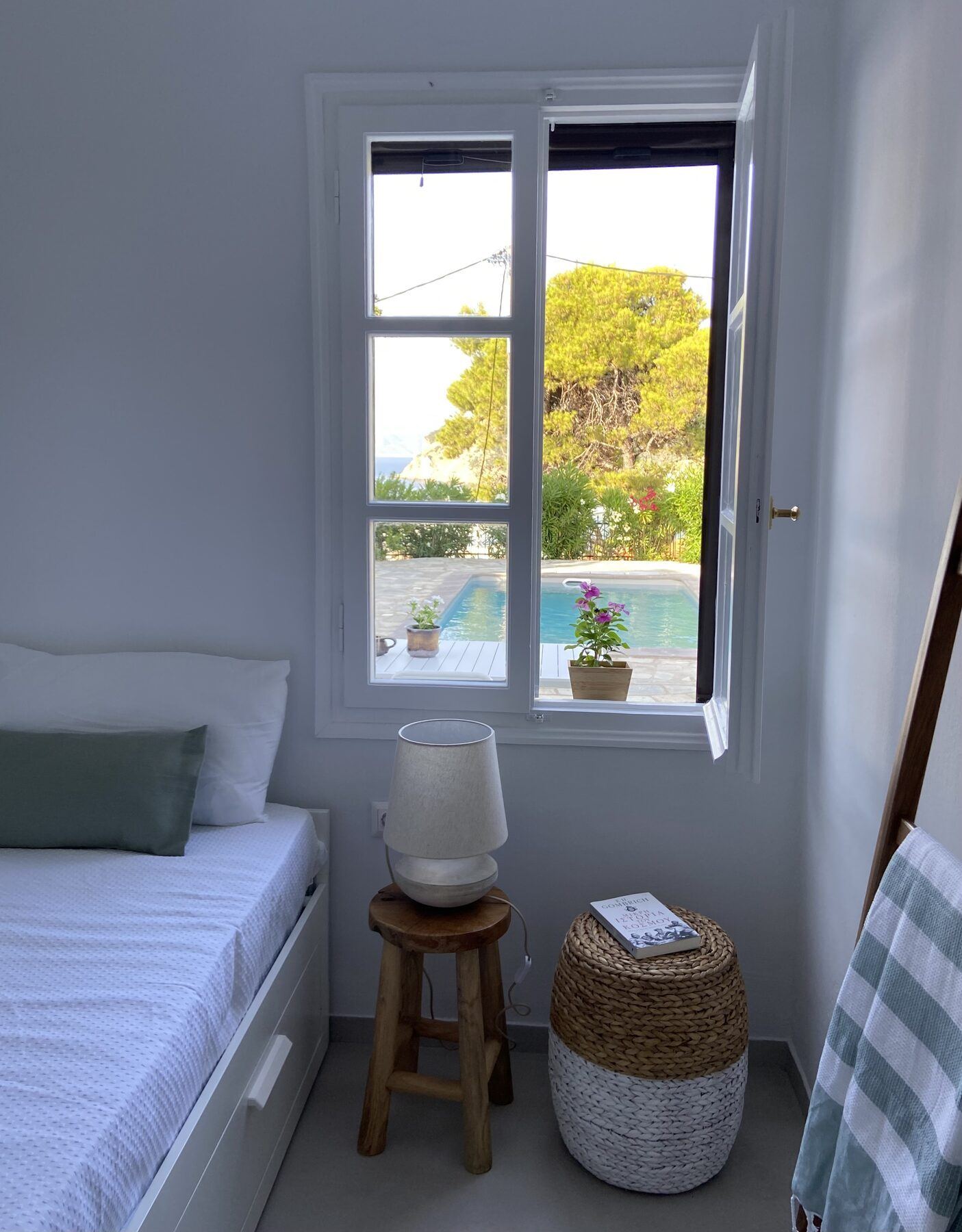 Bedroom four, a single bed with a view of the pool