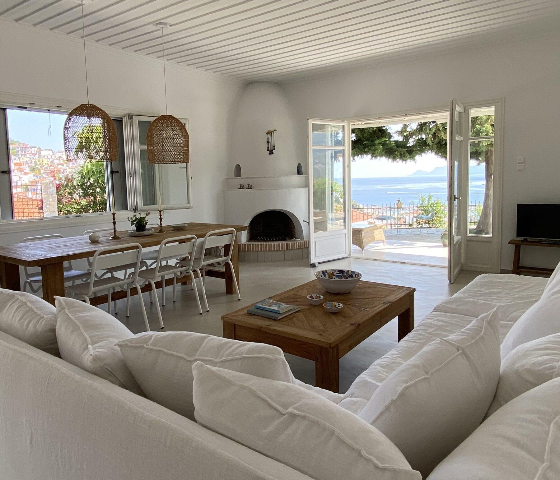 Open-plan living room at Villa Icelle, doors open to the terrace and the sea